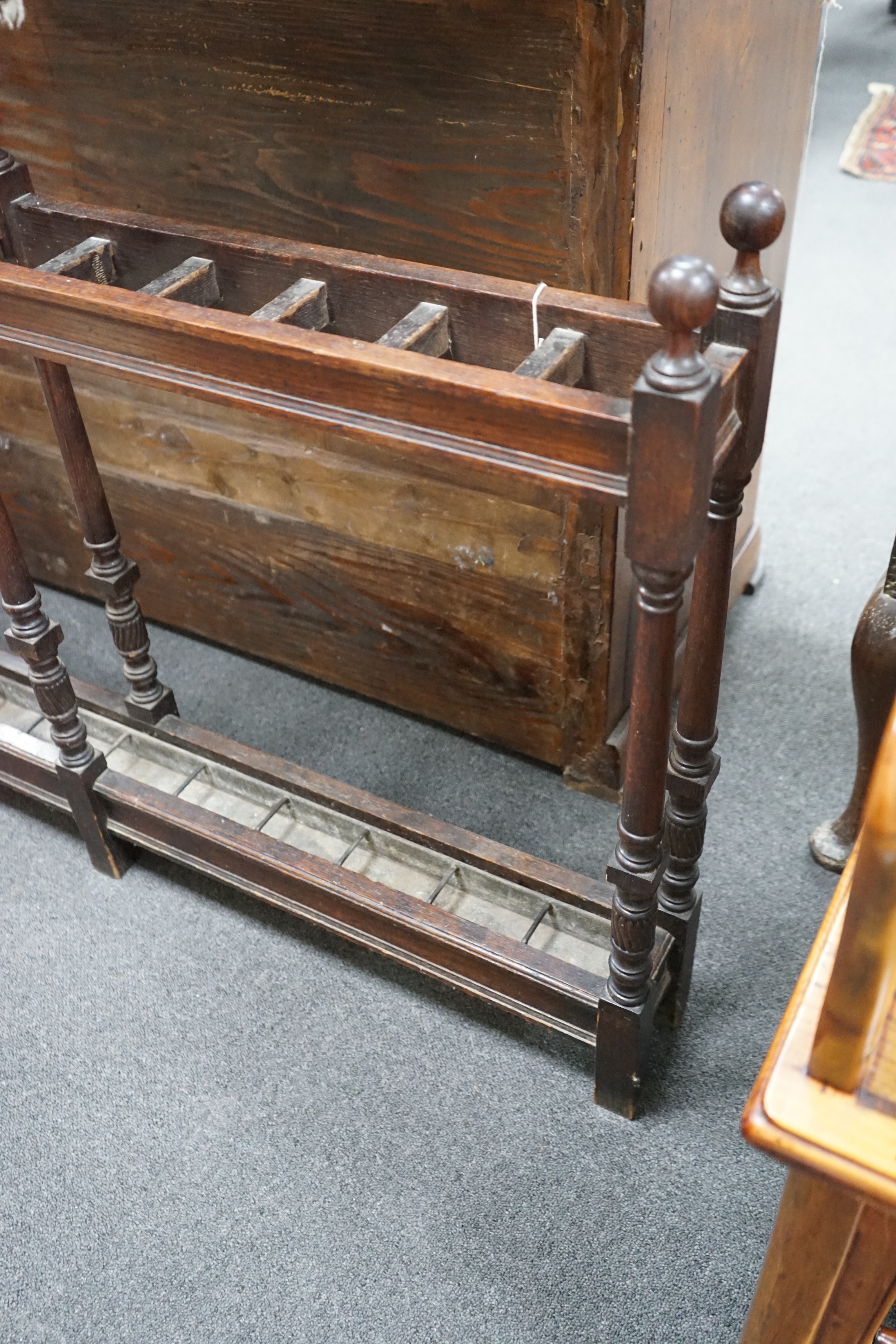 A large Victorian oak club stickstand, with zinc drip trays, width 122cm, depth 14cm, height 77cm